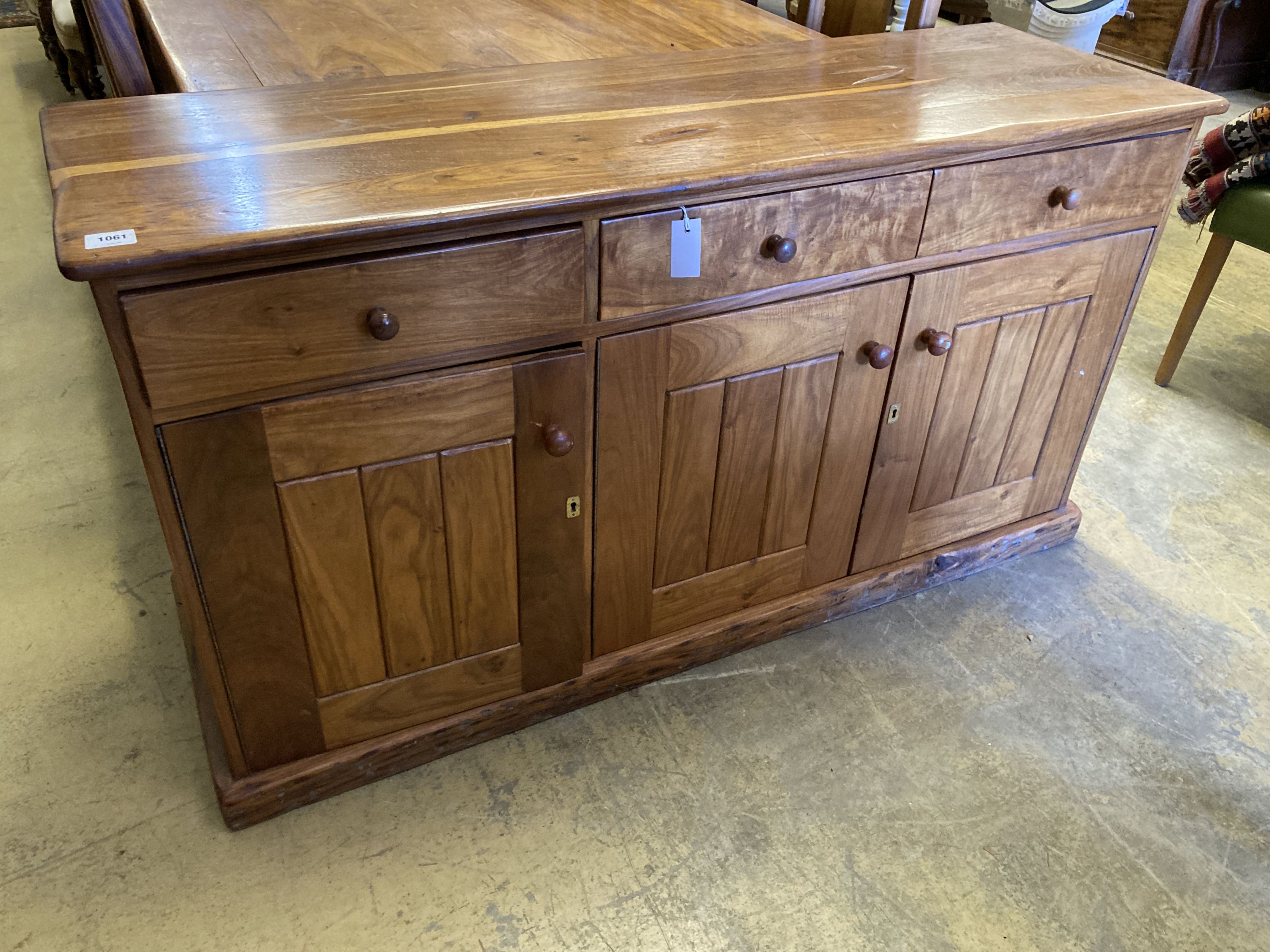 A hardwood suite, table length 200cm, depth 118cm, height 78cm